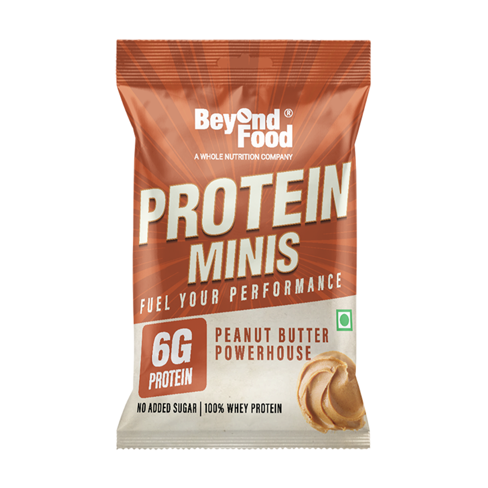 Packaging for Beyond Food Protein Minis, with a brown and white color scheme, featuring an image of a peanut butter mini bar and text highlighting 6g of protein, no added sugar, and 100% whey protein.
